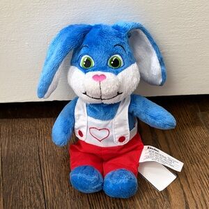 Kinder bunny plush with red overalls